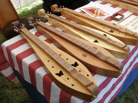 Samples of Gardner's Dulcimers under their sutlers tent at Cedar Creek<br>Hand crafted by Don Gardner. Visit their website: www.gardnersdulcimer.com